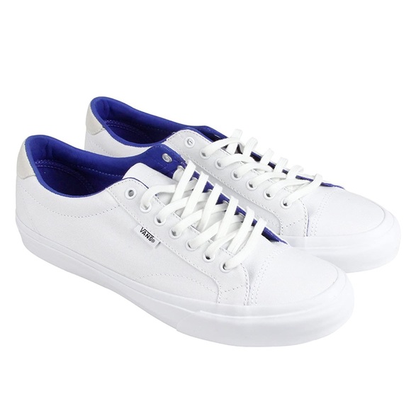 all white low top vans